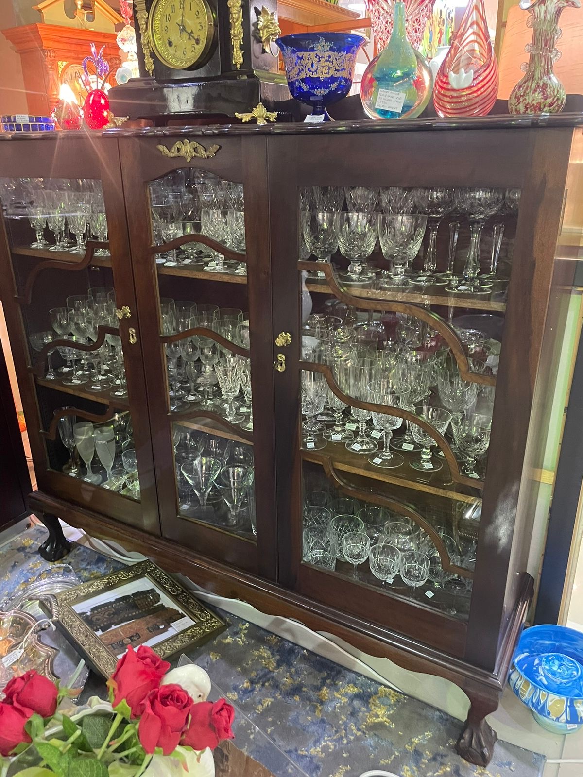 Stinkwood ball & claw display cabinet: R35,000