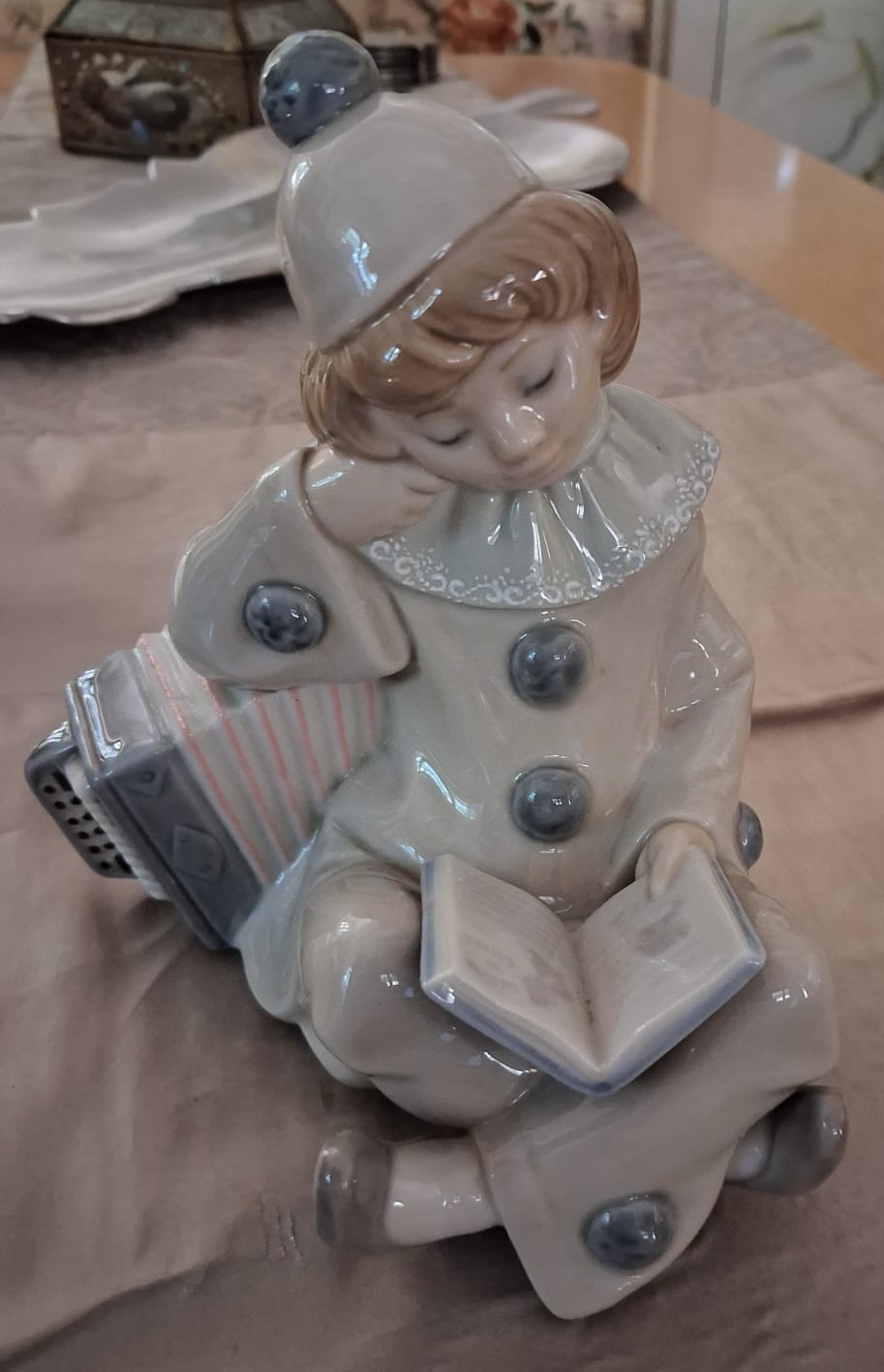 Lladro Girl with accordian reading a book: R2,500