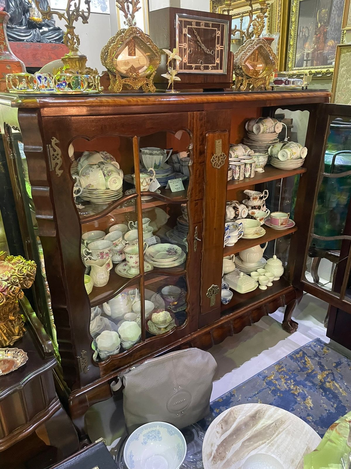 Stinkwood ball & claw display cabinet: R26,000