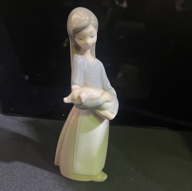 Lladro Girl with a pig figurine
