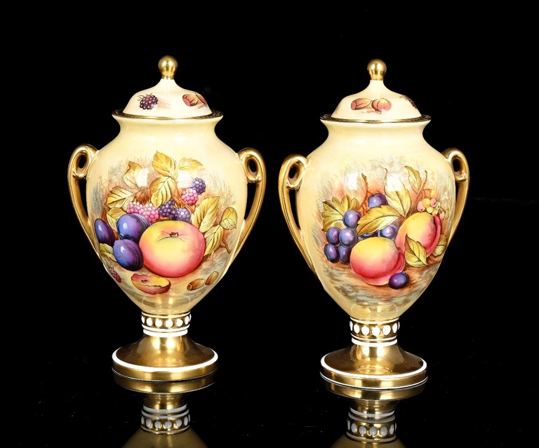 Pair of Aynsltey Orchid two-handled lidded urns, signed D Jones