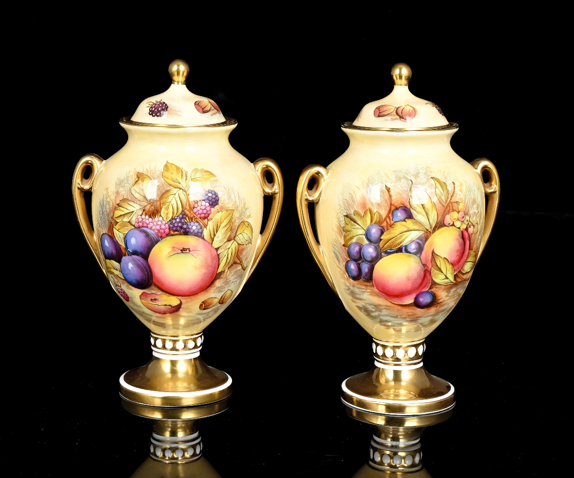 Pair of Aynsltey Orchid two-handled lidded urns, signed D Jones