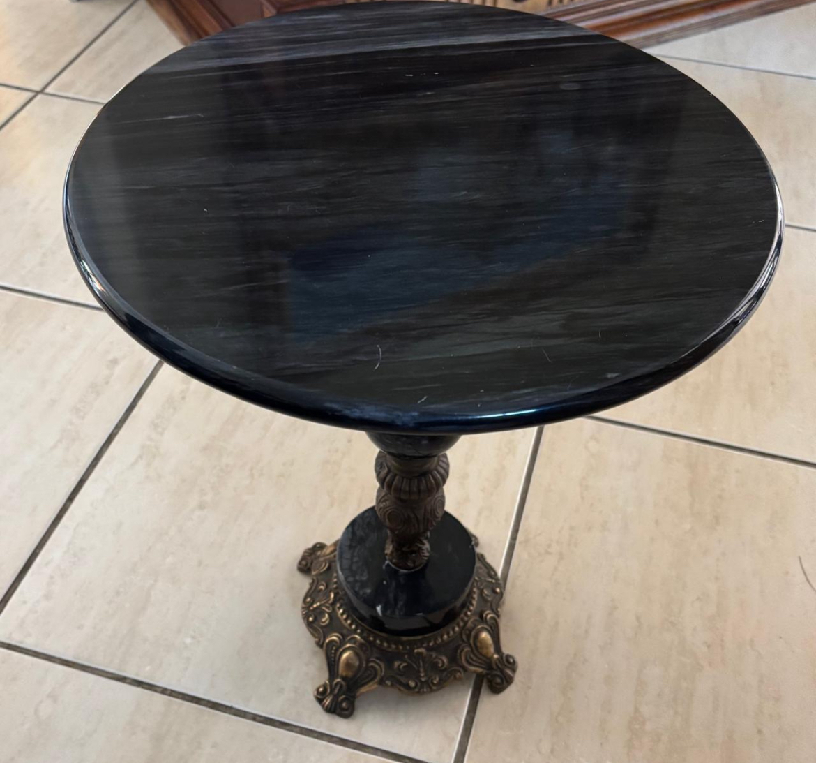 Low table with black marble table top & bronze base: R4,500