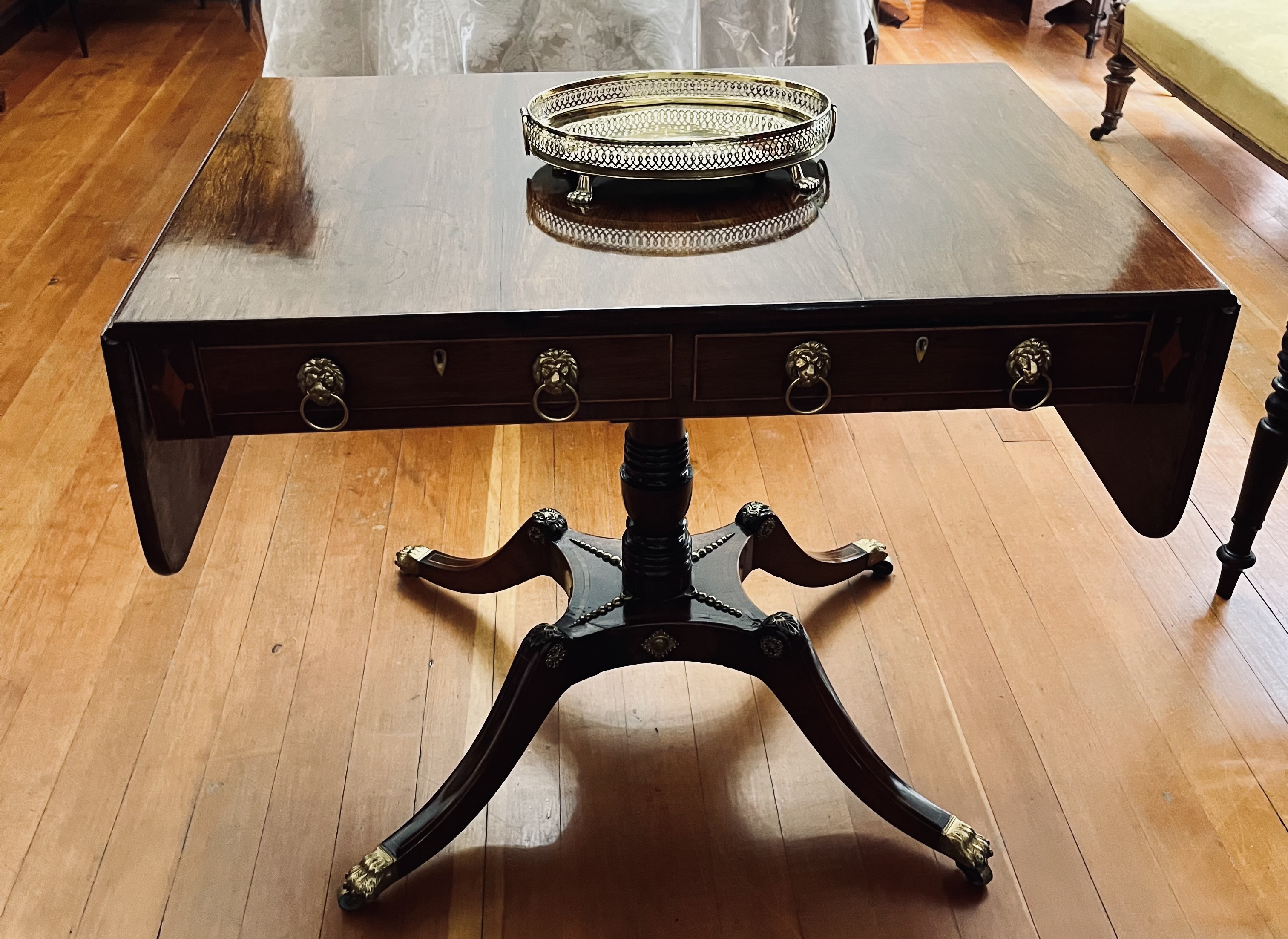 Regency mahogany sofa table with brass detailing and casters: POR