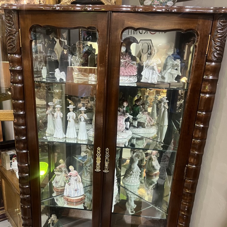 Stinkwood corner ball & claw display cabinet: R25,000