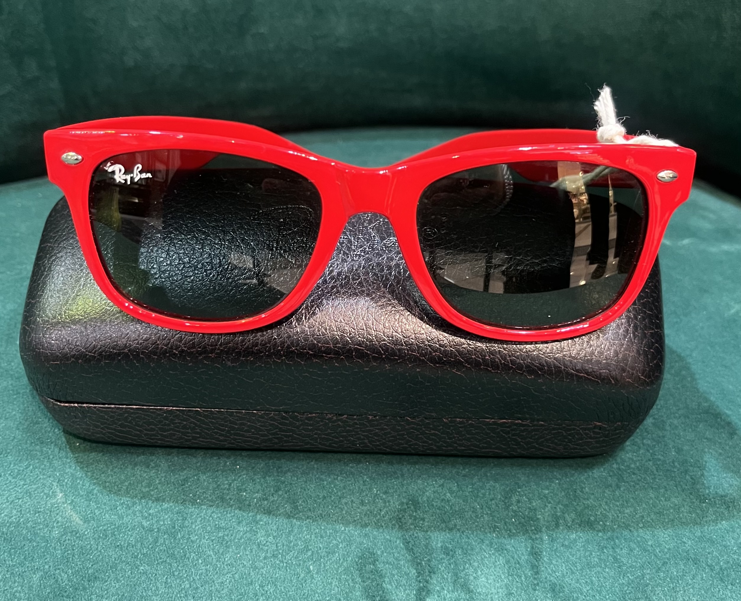 Pair of Ray-Ban Wayfarer sunglasses in red