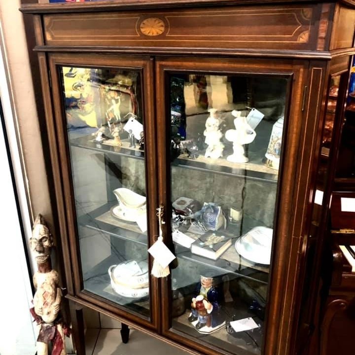Edwardian bookshelf with handmade glass panels and olive green velvet covered shelves, early 20th Century, in perfect condition and with original key. Size: 1.53m (height) x 0.93m (width) x 0.39m (depth) Price: R12,000.00
