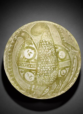 A rare intact Abbasid lustre pottery bowl depicting a griffin, Iraq, 9th/10th century