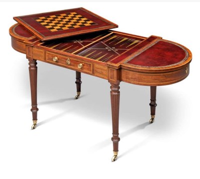 A REGENCY MAHOGANY GAMES AND WRITING-TABLE