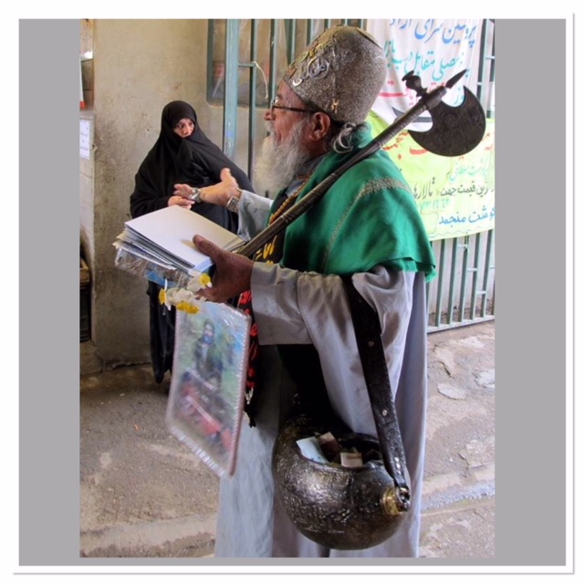 A dervish with his coco de mer beggar's bowl