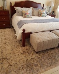 The oversized carpet with all furniture on top in the bedroom. If you choose this option be sure to air the carpet regularly!