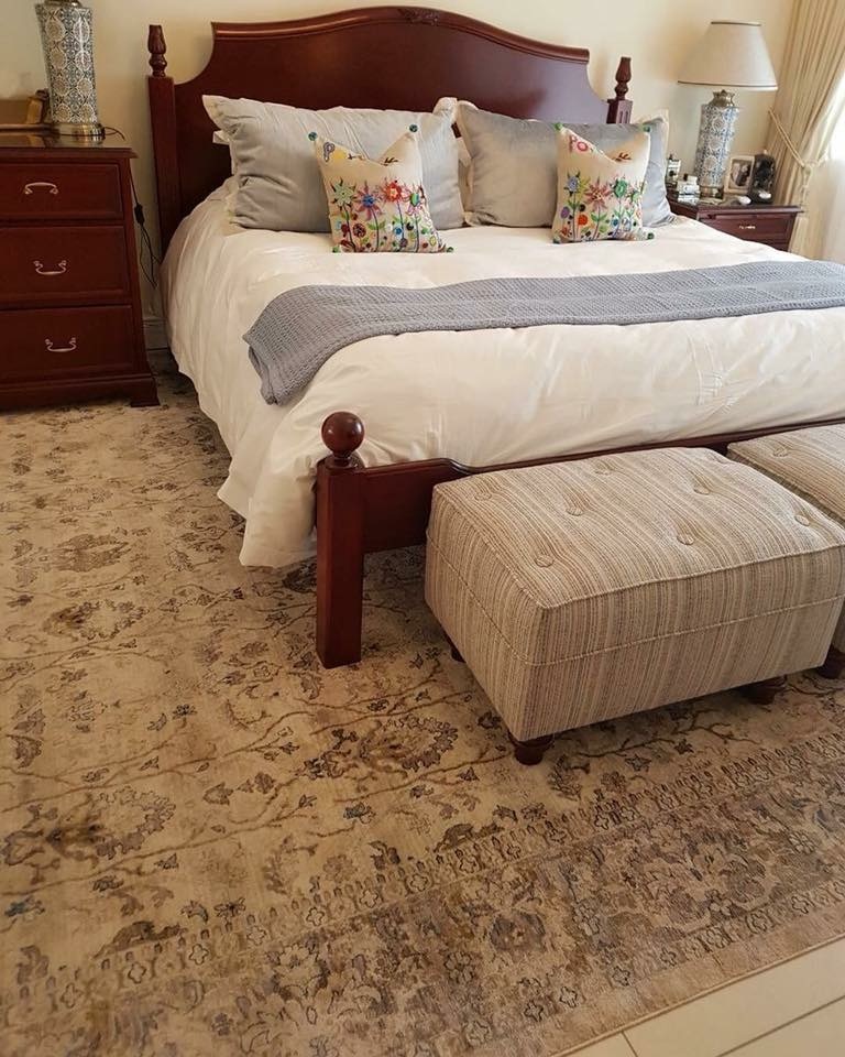 The oversized carpet with all furniture on top in the bedroom. If you choose this option be sure to air the carpet regularly!